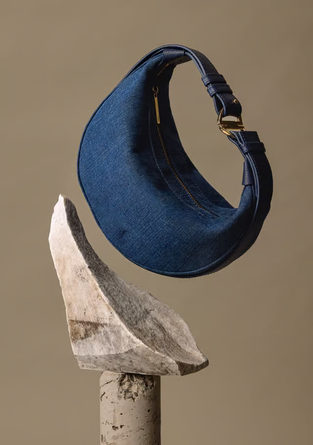 Curved Crescent Denim Bag With Multi-Size Adjustable Strap and Leather Decorative Trim
